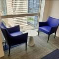 Crawford & Company - OUE Downtown | Products seen: [Uno Coffee Table – Dia445 - (Sintered)<br />
 & Celest Armchair]